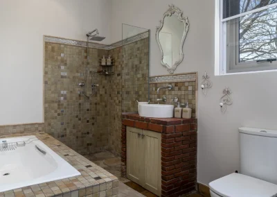 Bathroom of Le Palmier self-catering cottage at Bonne Chance Luxury estate, featuring modern amenities and elegant decor.